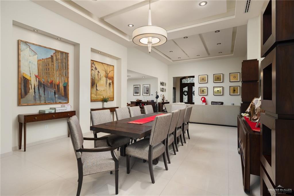 809 Rio Grande Drive Mission, TX 78572 - Photo 9 of 43 a view of a dining room with furniture a chandelier and a window