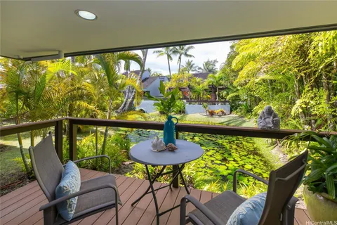 a view of a balcony with chairs