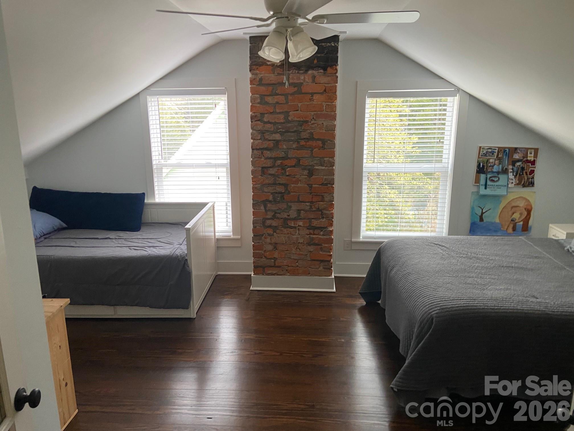201 Main Street Matthews, NC 28105 - Photo 15 of 16 a bed sitting in a bedroom next to a window