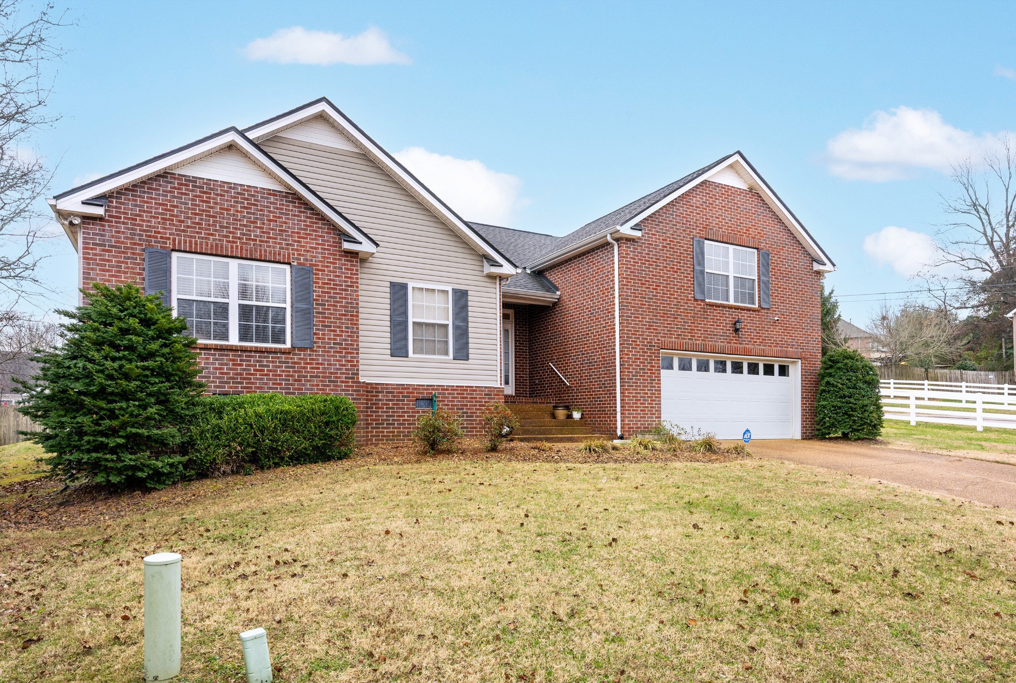 2601 Danbury Circle Spring Hill, TN 37174 - Photo 30 of 31 a front view of a house with a yard and garage