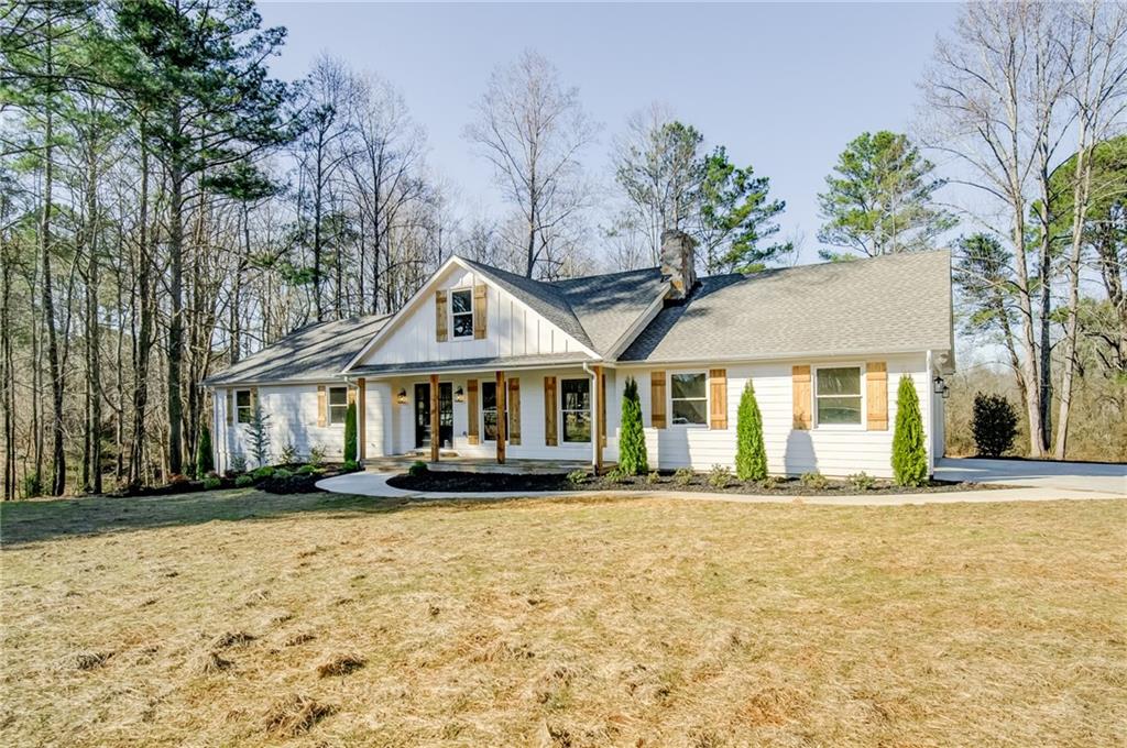735 Avery Road Canton, GA 30115 - Photo 1 of 1 a front view of a house with a yard