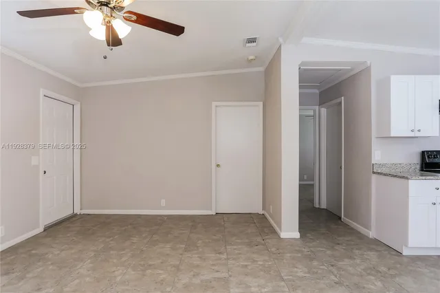 a view of a kitchen with a sink and cabinets