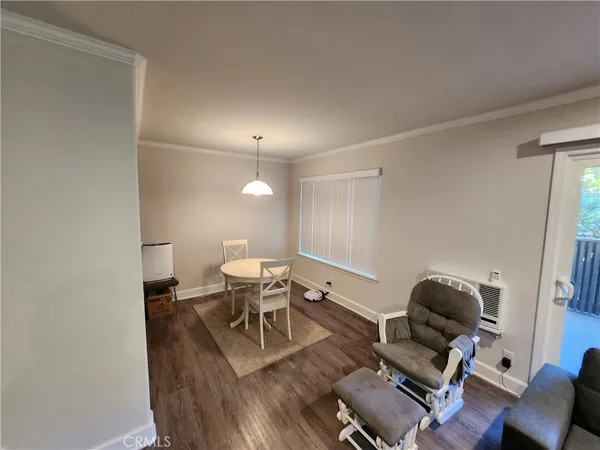 a living room with furniture and a mirror