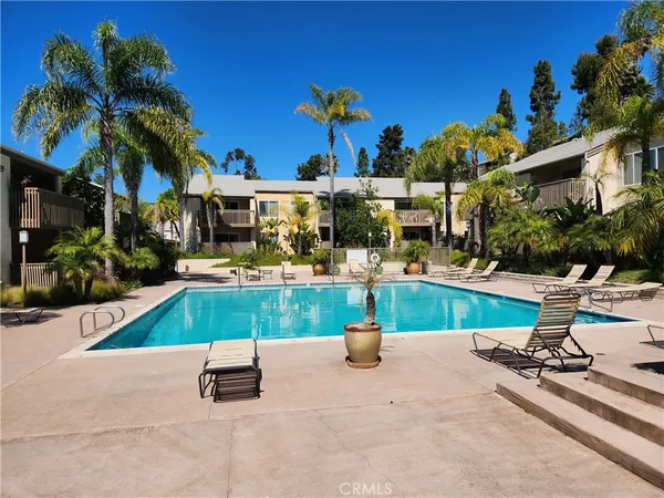 a swimming pool with outdoor seating and yard