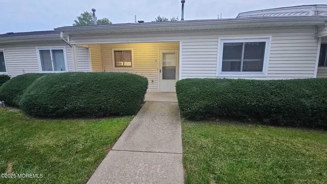 a view of a house with a garden