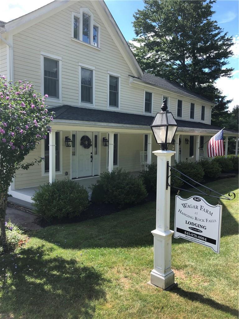 541 Ulster Heights Road Ellenville, NY 12428 - Photo 1 of 1 a front view of a house with garden