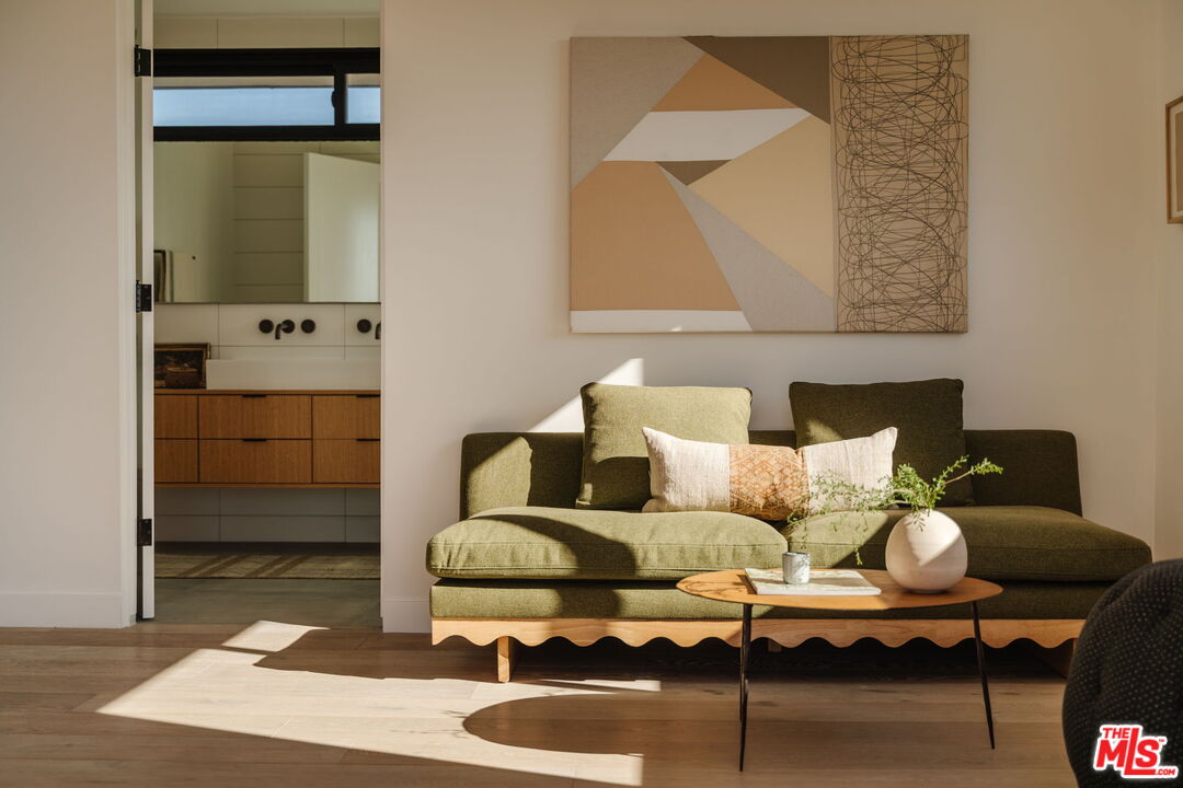 6767 Wandermere Road Malibu, CA 90265 - Photo 19 of 46 a living room with furniture and wooden floor