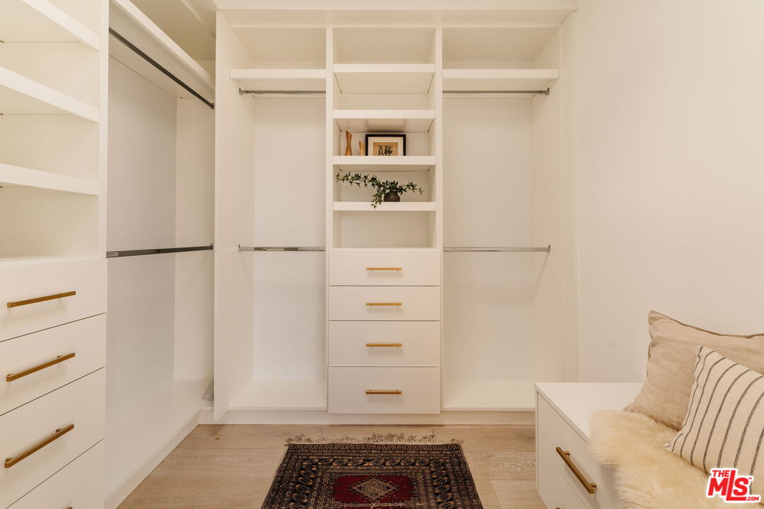 6767 Wandermere Road Malibu, CA 90265 - Photo 22 of 46 a view of walk in closet with empty racks