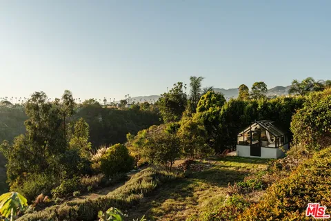 an aerial view of residential house with outdoor space