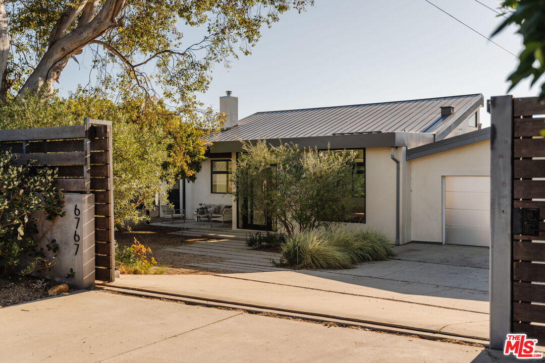 6767 Wandermere Road Malibu, CA 90265 - Photo 4 of 46 a front view of a house with garden