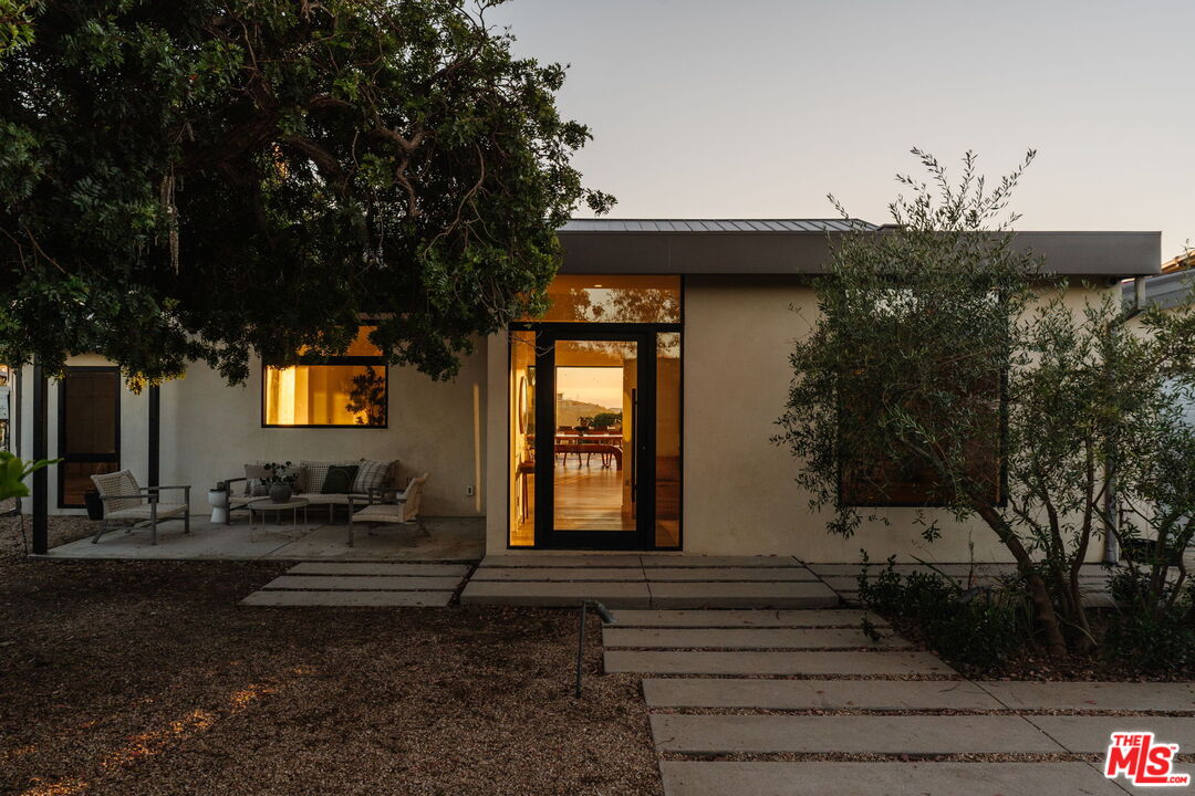 6767 Wandermere Road Malibu, CA 90265 - Photo 46 of 46 a front view of a house with a yard
