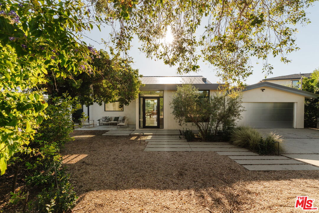 6767 Wandermere Road Malibu, CA 90265 - Photo 5 of 46 a view of a house with a tree in the background