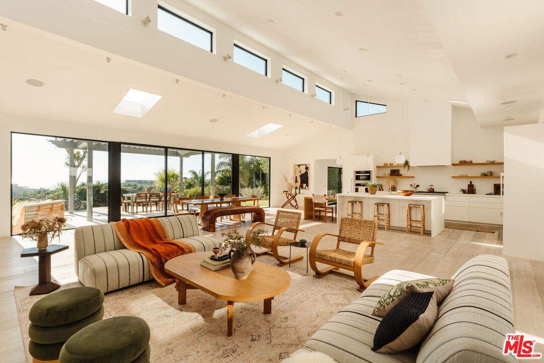 6767 Wandermere Road Malibu, CA 90265 - Photo 9 of 46 a living room with furniture and a large window