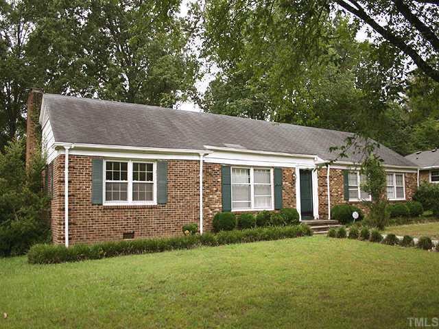 5320 Revere Road Durham, NC 27713 - Photo 1 of 2 a backyard of a house with a garden and plants