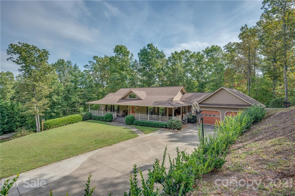 1426 Hayes Road Columbus, NC 28722 - Photo 2 of 45 a front view of a house with a yard and green space