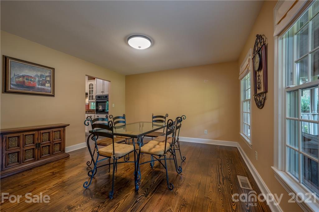 1426 Hayes Road Columbus, NC 28722 - Photo 17 of 45 a view of a dining room with furniture and a book shelf