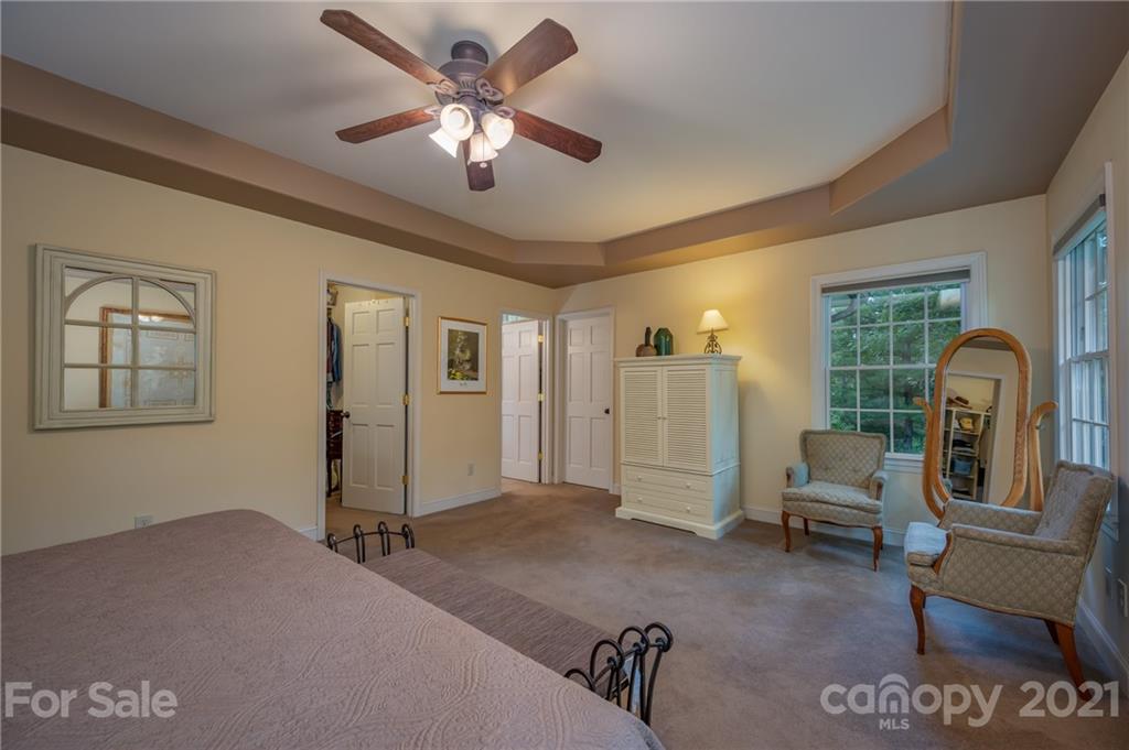 1426 Hayes Road Columbus, NC 28722 - Photo 21 of 45 a living room with furniture and a chandelier