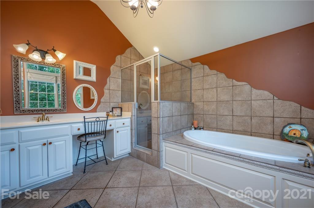 1426 Hayes Road Columbus, NC 28722 - Photo 23 of 45 a bathroom with a sink a toilet and bathtub