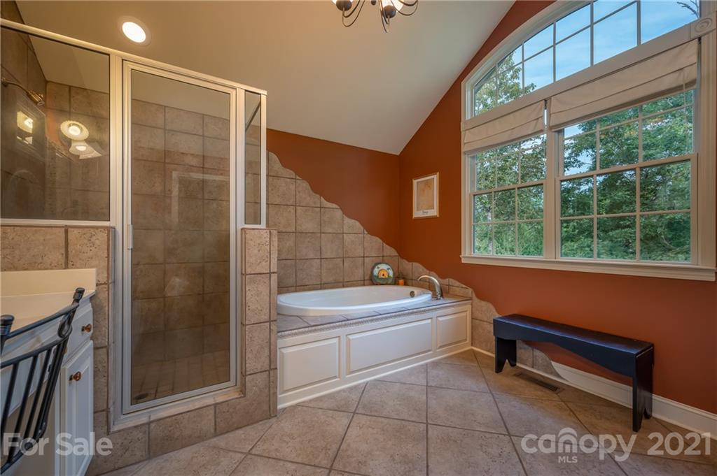 1426 Hayes Road Columbus, NC 28722 - Photo 24 of 45 a bathroom with a sink a toilet and shower