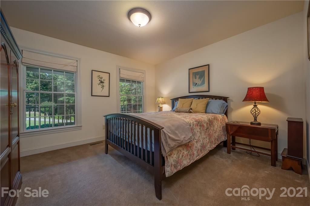 1426 Hayes Road Columbus, NC 28722 - Photo 25 of 45 a bedroom with a bed and a window