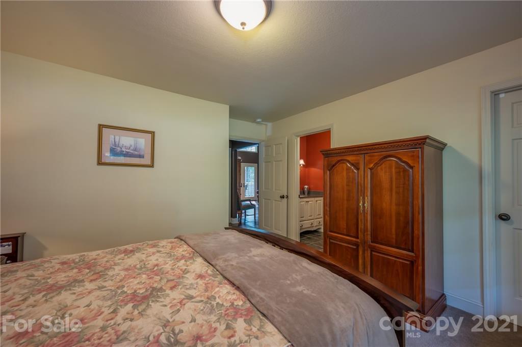 1426 Hayes Road Columbus, NC 28722 - Photo 26 of 45 a bedroom with a bed and a window