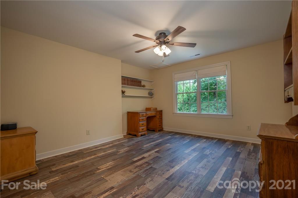1426 Hayes Road Columbus, NC 28722 - Photo 27 of 45 a view of an empty room with a window and wooden floor
