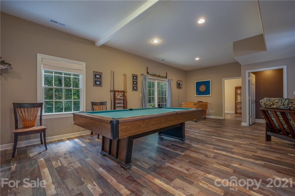 1426 Hayes Road Columbus, NC 28722 - Photo 31 of 45 a room with wooden floors pool table and windows