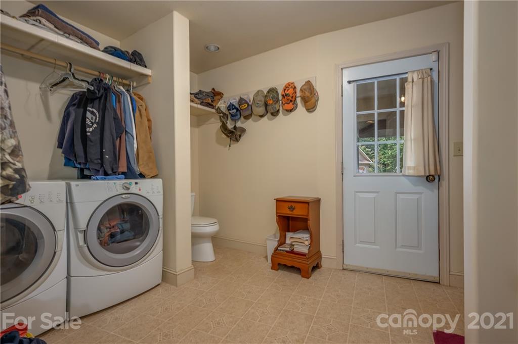 1426 Hayes Road Columbus, NC 28722 - Photo 34 of 45 a utility room with closet dryer and washer