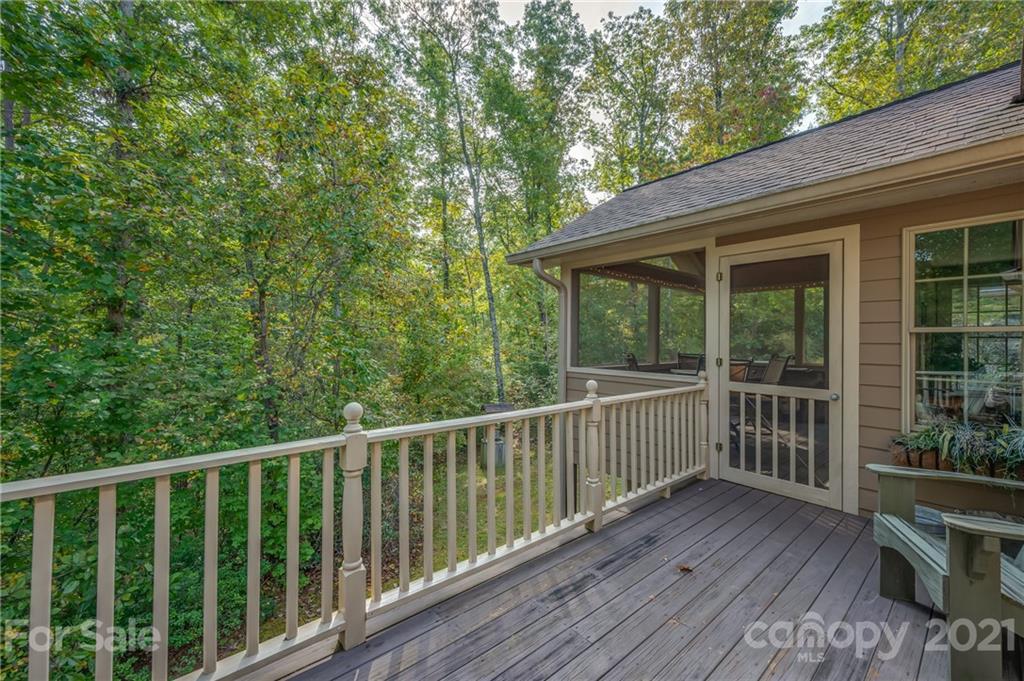 1426 Hayes Road Columbus, NC 28722 - Photo 35 of 45 a view of a wooden deck and a yard