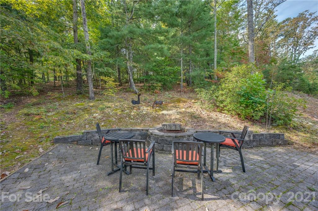 1426 Hayes Road Columbus, NC 28722 - Photo 38 of 45 a backyard of a house with table and chairs