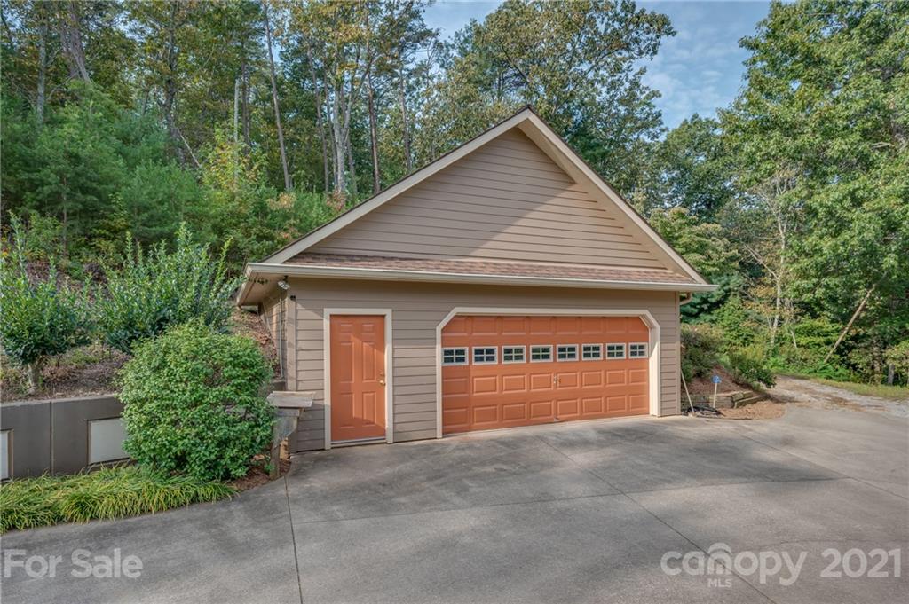 1426 Hayes Road Columbus, NC 28722 - Photo 45 of 45 a view of a house with a yard and garage