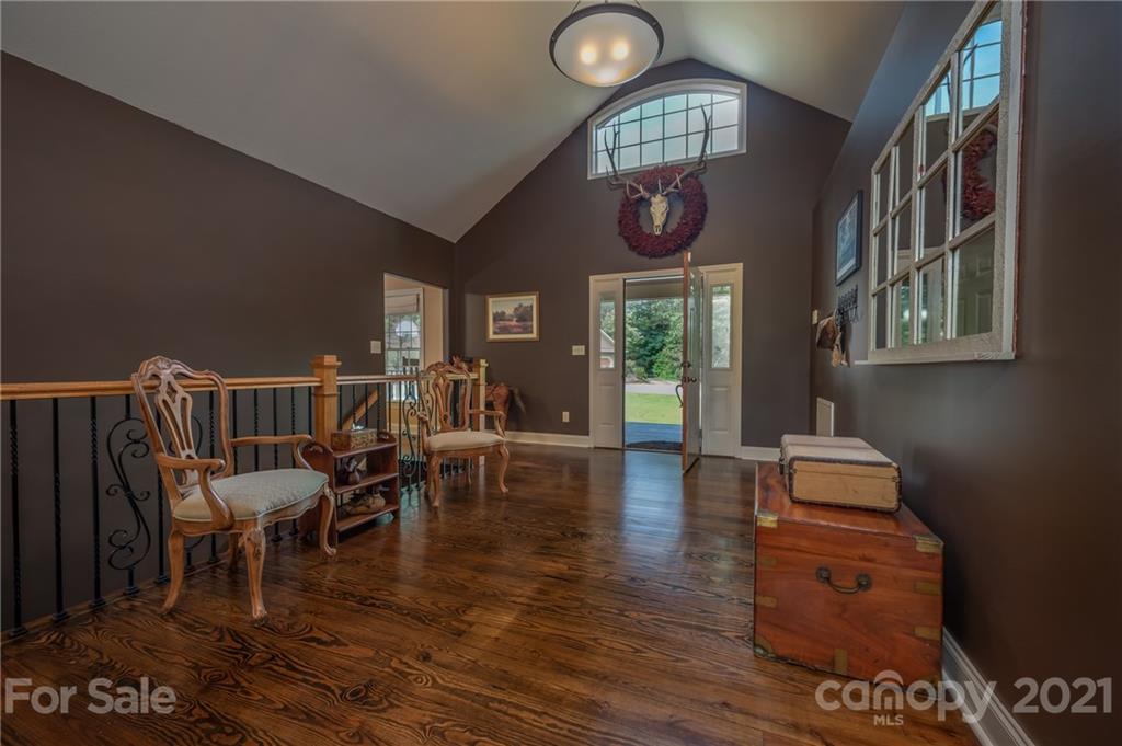 1426 Hayes Road Columbus, NC 28722 - Photo 8 of 45 a living room with furniture and a floor to ceiling window