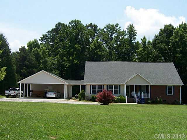 1083 Sharon Road York, SC 29745 - Photo 1 of 16 a front view of a house with garden