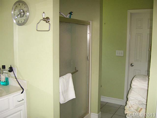 1083 Sharon Road York, SC 29745 - Photo 14 of 16 a bathroom with a mirror and a shower