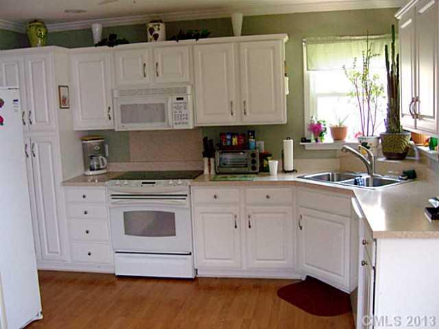 1083 Sharon Road York, SC 29745 - Photo 3 of 16 a kitchen with stainless steel appliances white cabinets and a sink