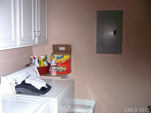 1083 Sharon Road York, SC 29745 - Photo 7 of 16 a table with wine cabinets and a wooden floor