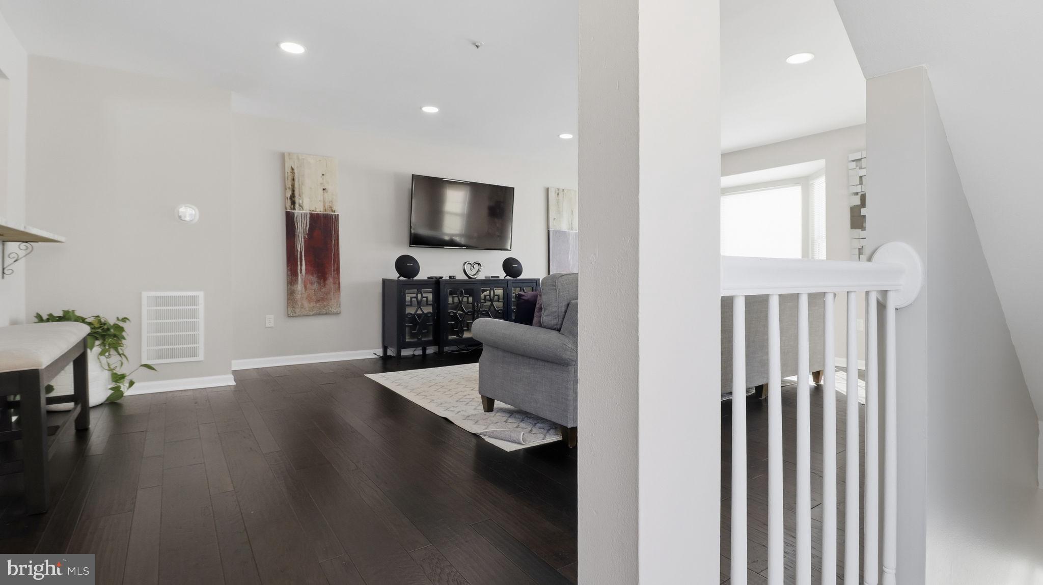 15922 Edgeview Terrace Bowie, MD 20716 - Photo 15 of 41 a living room with furniture and a flat screen tv