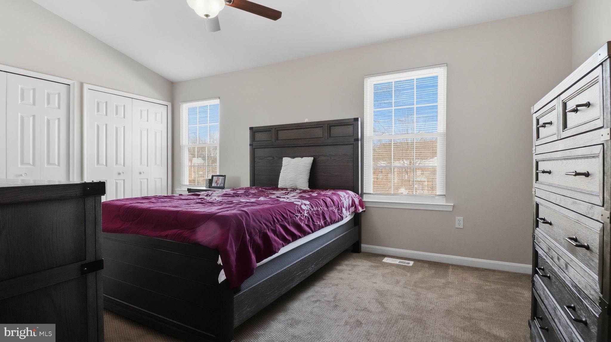 15922 Edgeview Terrace Bowie, MD 20716 - Photo 26 of 41 a bedroom with a bed and a window
