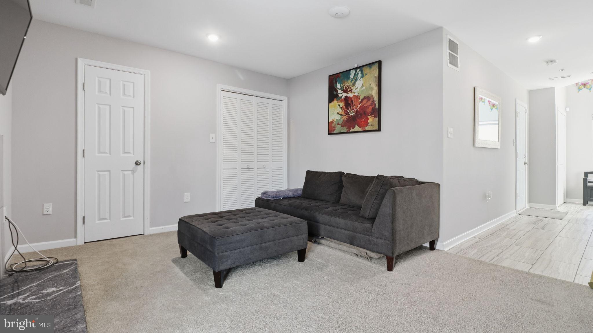 15922 Edgeview Terrace Bowie, MD 20716 - Photo 3 of 41 a living room with furniture and a walk in closet