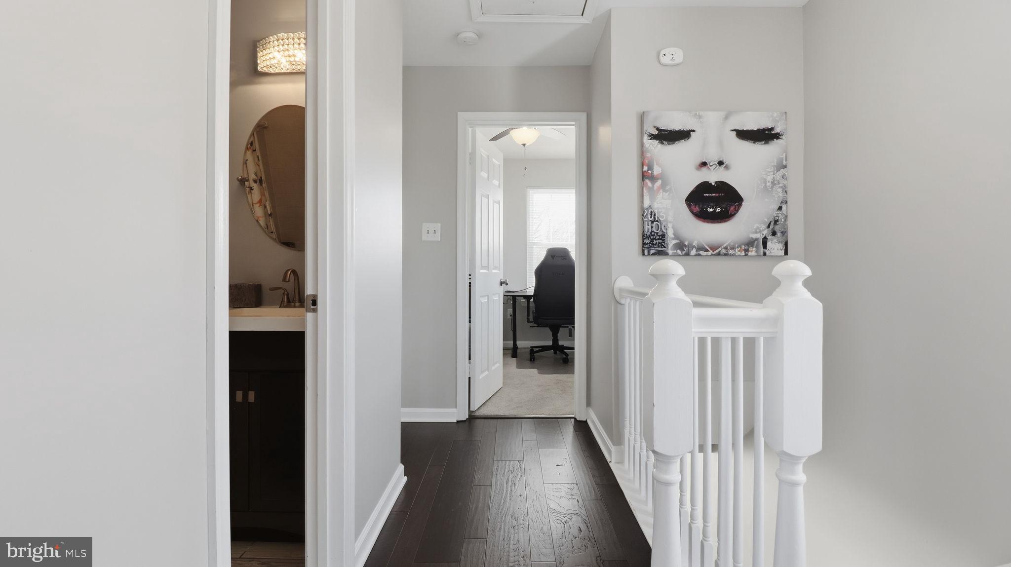 15922 Edgeview Terrace Bowie, MD 20716 - Photo 32 of 41 a view of a bathroom from a hallway