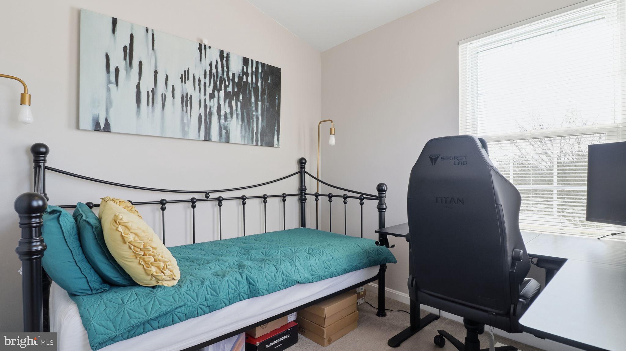 15922 Edgeview Terrace Bowie, MD 20716 - Photo 36 of 41 a view of a bedroom with furniture and a window