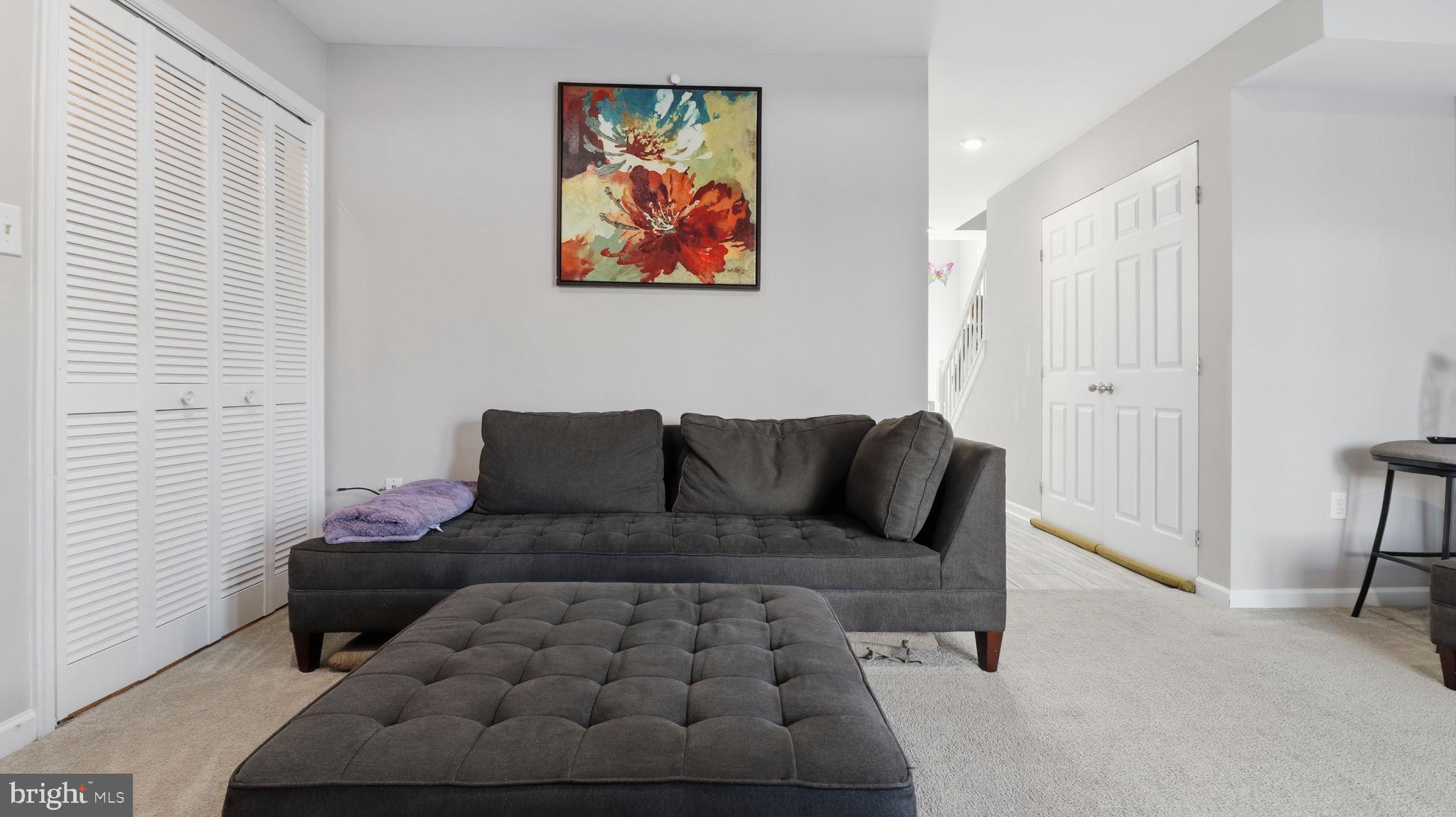 15922 Edgeview Terrace Bowie, MD 20716 - Photo 4 of 41 a living room with furniture and a couch