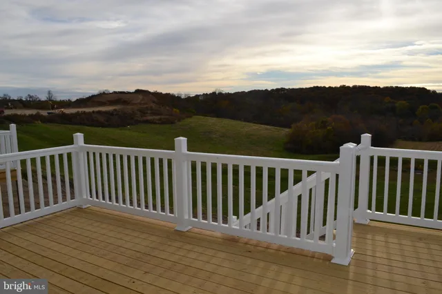 a view of balcony with wooden floor and city view