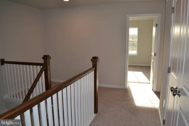 a view of a hallway with windows