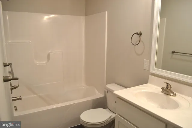 a bathroom with a sink toilet and a bathtub