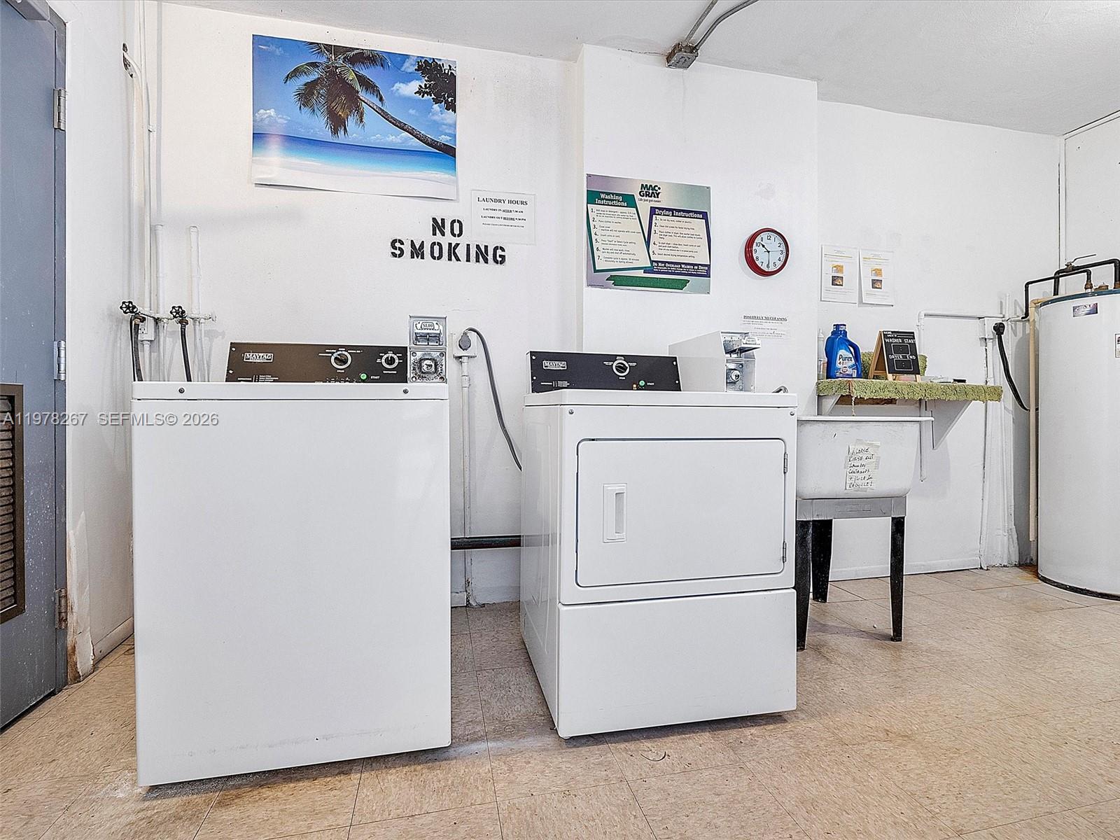 2050 Northeast 39th Street, Unit W212 Lighthouse Point, FL 33064 - Photo 11 of 17 a utility room with dryer and washer