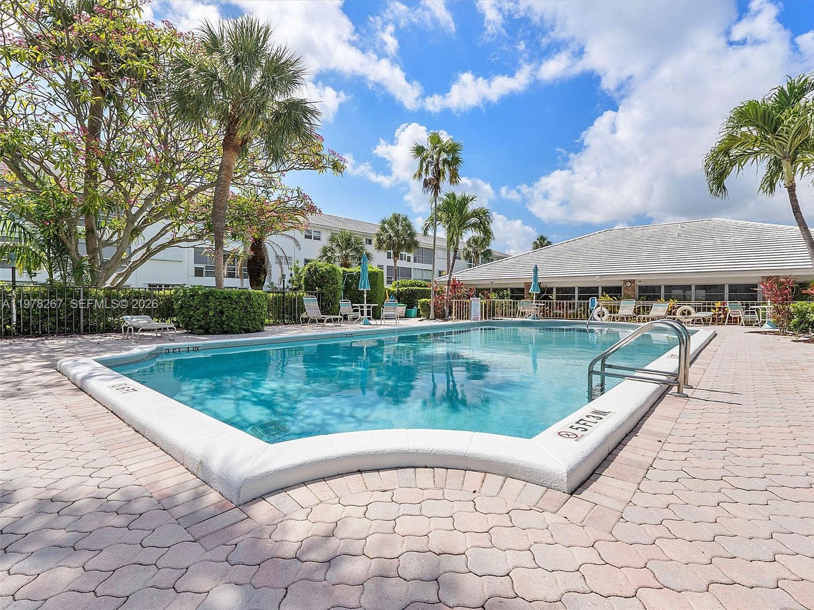 2050 Northeast 39th Street, Unit W212 Lighthouse Point, FL 33064 - Photo 13 of 17 a view of a lake with a house