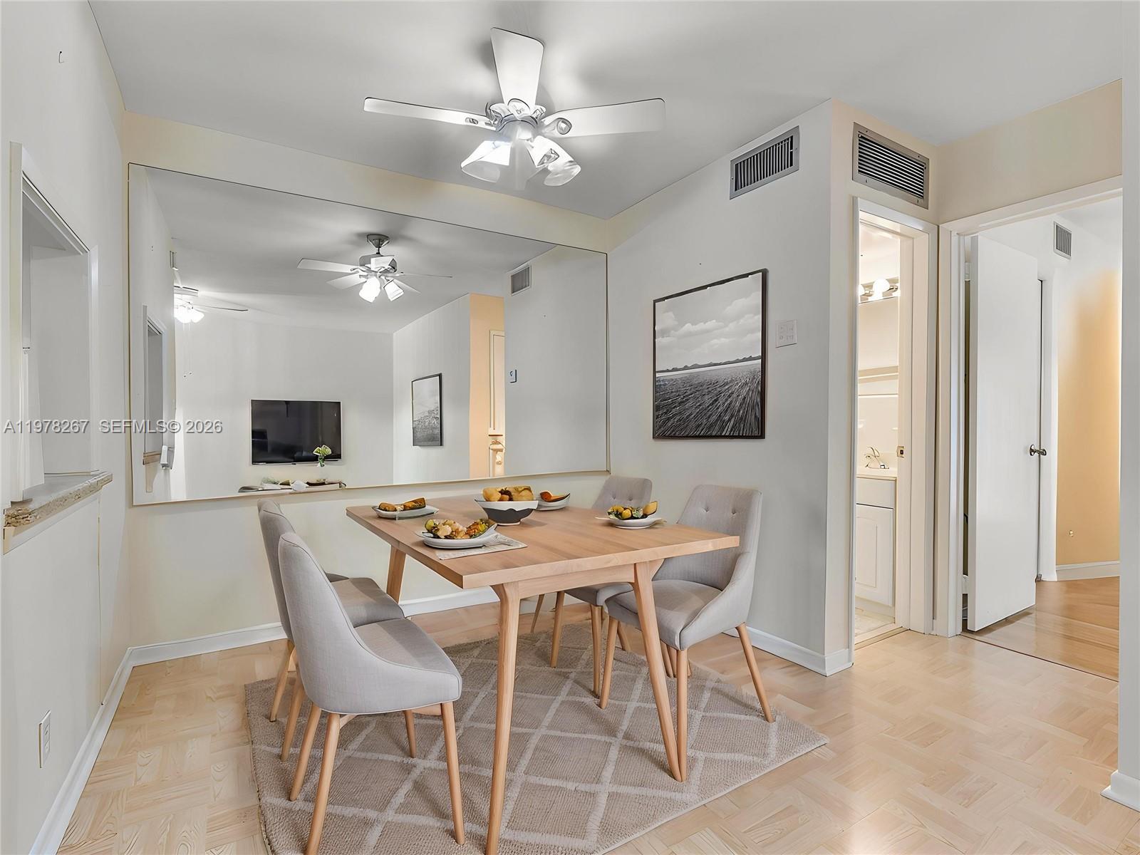 2050 Northeast 39th Street, Unit W212 Lighthouse Point, FL 33064 - Photo 2 of 17 a view of a dining room with furniture