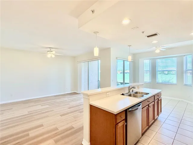 a kitchen with stainless steel appliances a stove a microwave and a refrigerator