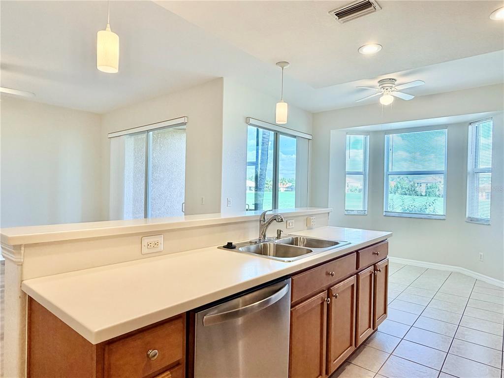 819 Fairwaycove Lane, Unit 102 Bradenton, FL 34212 - Photo 17 of 56 a kitchen with a sink cabinets and window